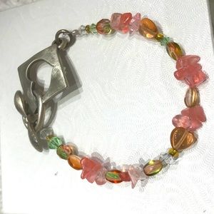 Costume jewelry bracelet with heart clasp